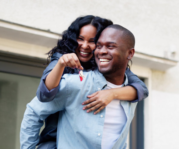 Newly Married Couple Celebrates Buying First Home