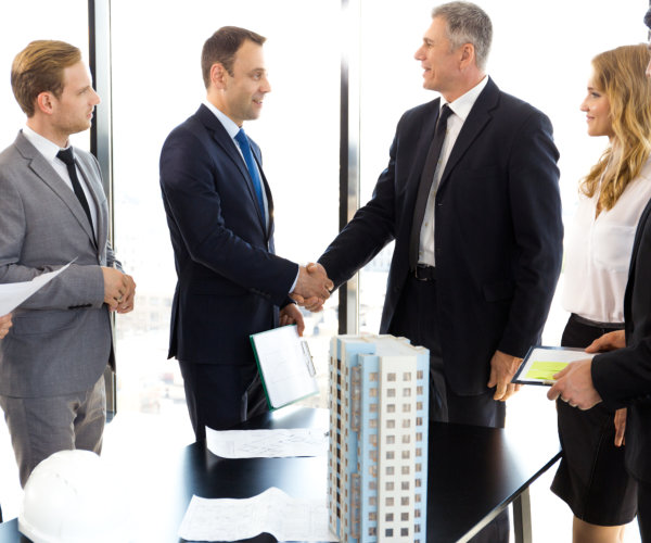 A group of people greeting each other