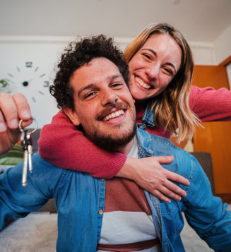 happy husband and wife hugging