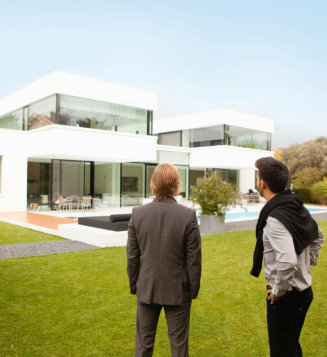 Two people watching house